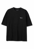 Schwarzes T-Shirt mit kurzen Ärmeln und Rundhalsausschnitt, kleine weiße "Pegador"-Logo auf der linken Brust, mittlere Größenetikett im Kragen sichtbar.