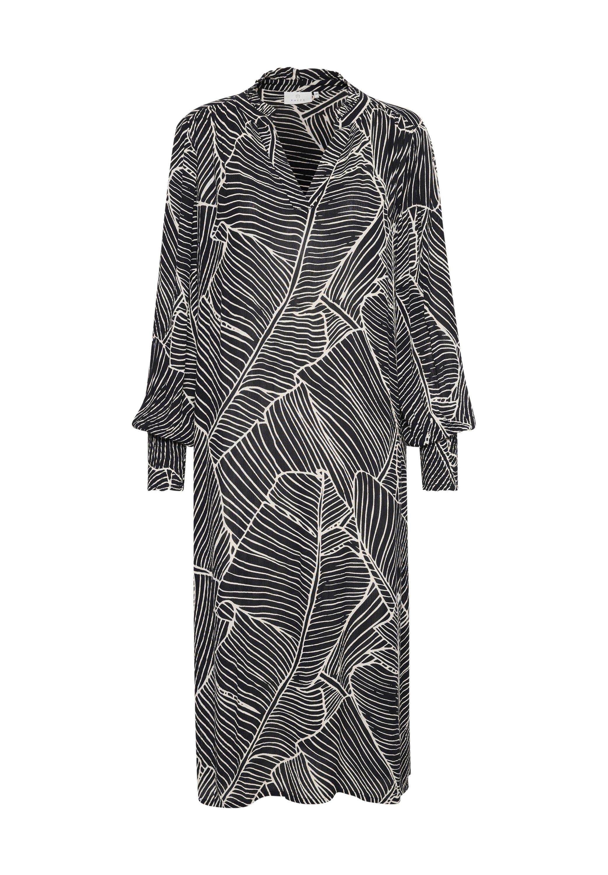 Schwarzes Kleid mit weißen Blattmustern, langen Ärmeln mit Bündchen, hohem Kragen und lockerer Passform. Der Stoff hat eine glatte Textur.