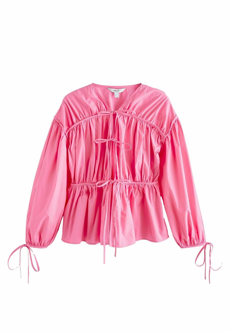 Rosa Bluse mit Puffärmeln aus glattem Stoff, mit einem gerafften Oberteil mit Kordelzug und elastischen Bündchen mit Bändern.