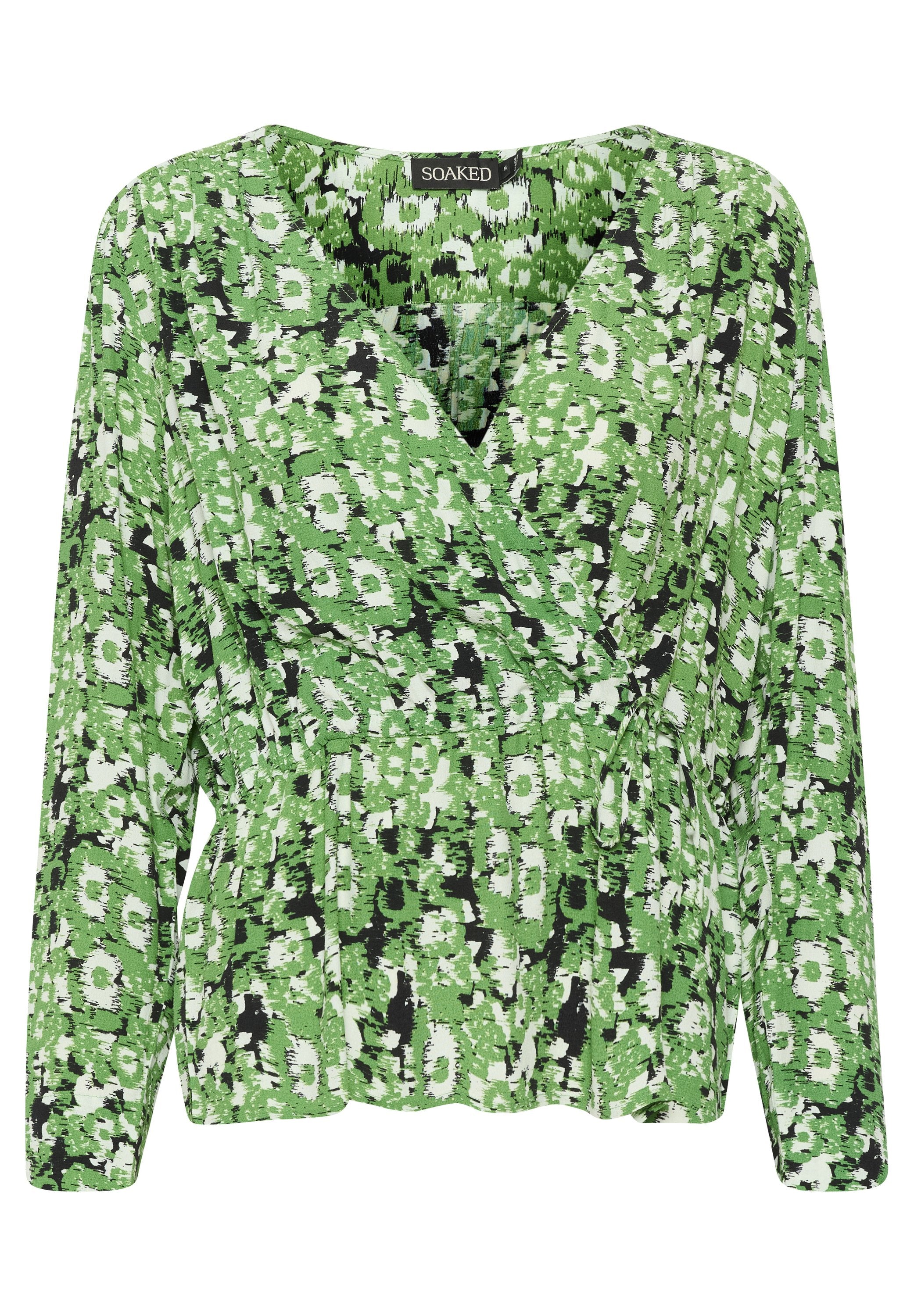 Grüne Blumenbluse mit langen Ärmeln, einem V-Ausschnitt und einer gerafften Taille. Der Stoff hat ein strukturiertes Muster mit schwarz-weißen Akzenten.