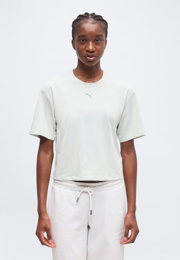 Puma RELAXED FIT - Sports T-shirt - créme de mint