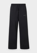 New Balance LINEAR GRAPHIC PANT - Tracksuit bottoms - black