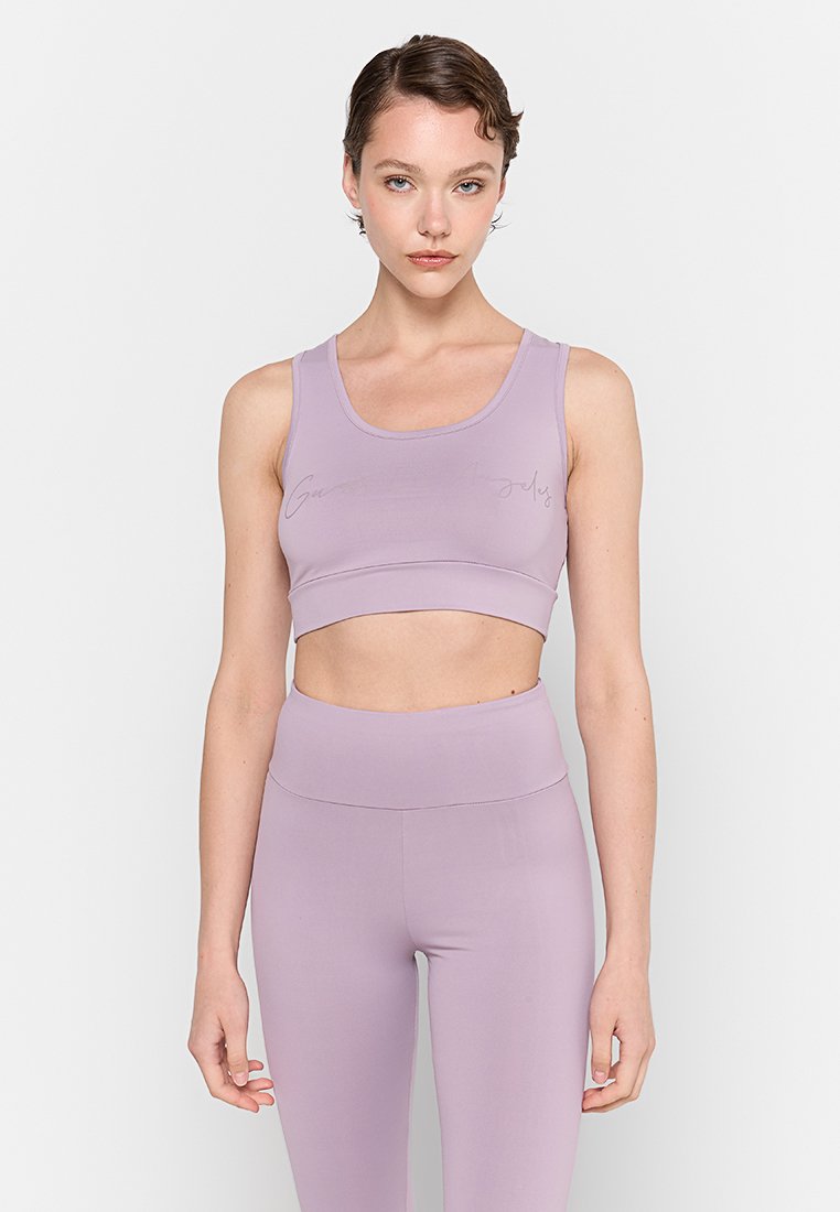 Hellblaues Crop-Top mit rundem Ausschnitt und dezentem Logo-Detail. Hergestellt aus glattem, dehnbarem Material, das für Komfort und Flexibilität sorgt.