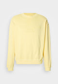 Gelber Pullover aus Baumwollmischung mit gerippten Bündchen und Saum, auf der Vorderseite mit dem geprägten "Tommy Jeans"-Logo. Klassisches Rundhalsdesign.