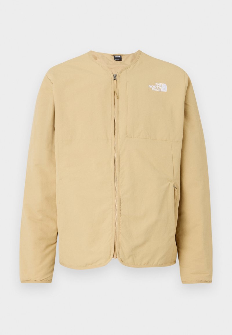 Helles Beige, Reißverschlussjacke mit Rundhalsausschnitt, ausgestattet mit einer Brusttasche und einem Logodetail auf der linken Seite. Hergestellt aus glattem, leichtem Stoff.
