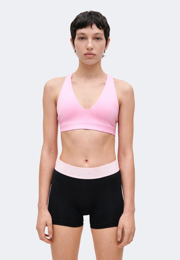 Nike Performance W NK DF INDY STRAPPY BRA - Medium support sports bra - pink rise/black
