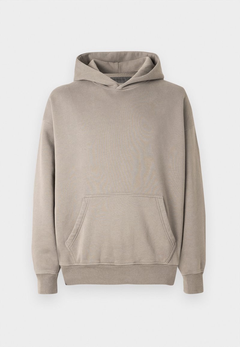 Hoodie in einem hellbeigen Farbton mit einer Kängurutasche, gerippten Bündchen und Saum. Hergestellt aus weichem, strukturiertem Stoff.