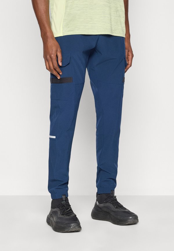 Under Armour TECH UTILITY WOVEN - Tracksuit bottoms - academy/white