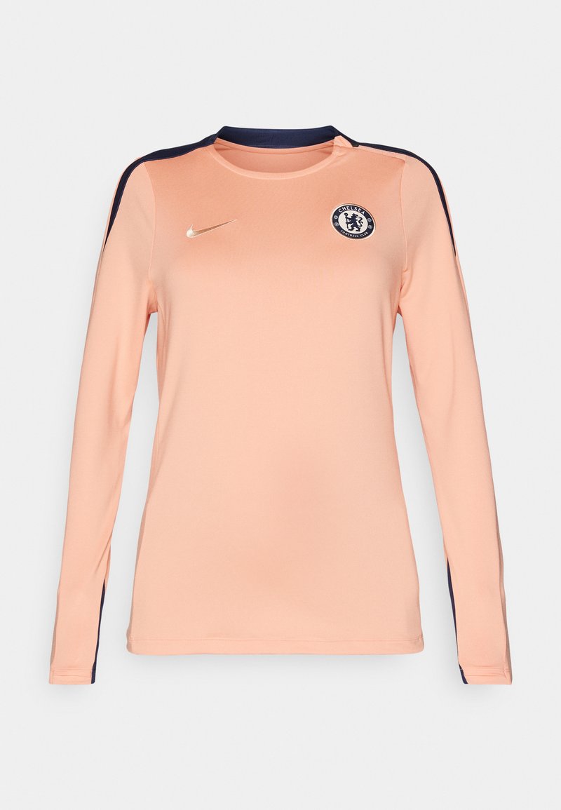Langarm-Jersey in hellem Pfirsich mit marineblauen Akzenten, mit rundem Halsausschnitt, Nike-Logo und Chelsea FC-Abzeichen auf der Brust.
