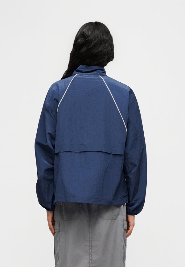 New Balance SPORT LEGACY JACKET