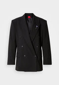 Doppelreihiger schwarzer Blazer mit großen Knöpfen, Reverskragen mit Ausschnitt und einem strukturierten Futter. Verfügt über eine dekorative Anstecknadel am Revers.