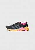Schwarzer Sportschuh mit grauen Streifen, pinken Akzenten und einer orangen Mittelsohle. Verfügt über ein strukturiertes Mesh-Obermaterial und einen gepolsterten Kragen für Komfort.