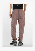 New Balance ATHLETICS - Tracksuit bottoms - earth shadow