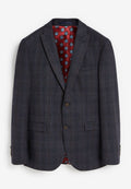 Dunkelgrauer Blazer mit kariertem Muster, ausgestattet mit einem roten Blumenmuster-Futter und braunen Knöpfen. Zwei Vordertaschen und Schalkragen.