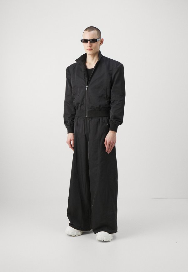 Han Kjøbenhavn OVERSIZED TRACK TROUSERS UNISEX