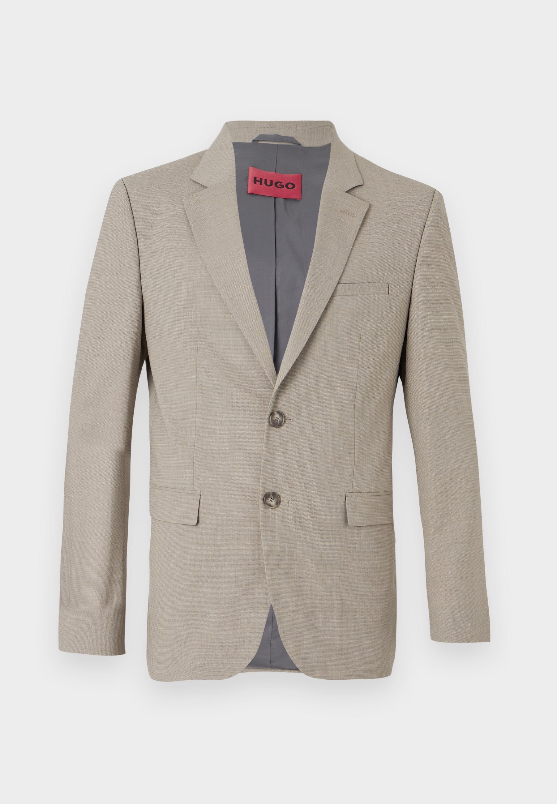 Beige Blazer mit zwei Knöpfen, mit Reverskragen und einer einzelnen Brusttasche. Mit grauem Stoff gefüttert. Subtile gewebte Struktur.
