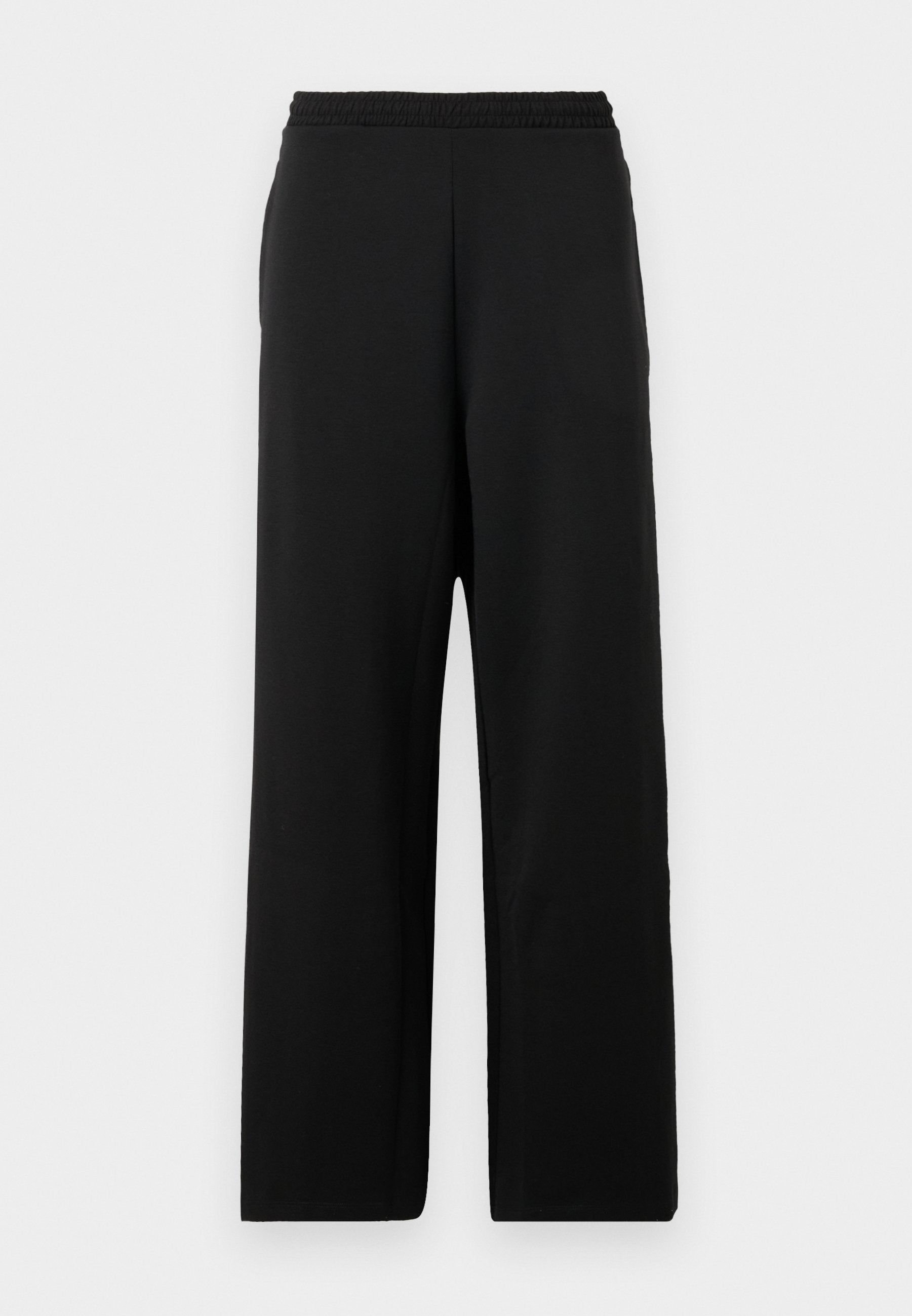 Schwarze, weit geschnittene Hosen aus weichem Stoff, mit einem elastischen Bund und einer glatten Textur ohne Muster oder Akzente.