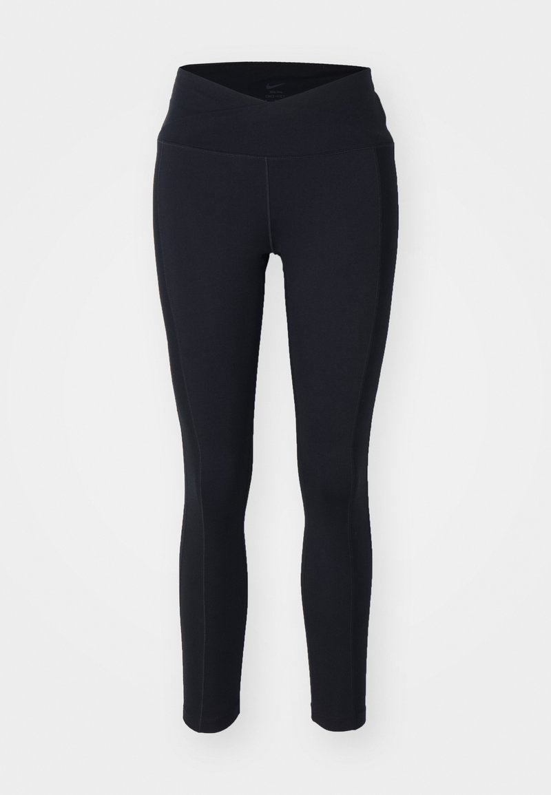 Schwarze Leggings mit einem hohen, gekreuzten Bund. Hergestellt aus elastischem Stoff mit dezenten Nähdetails. Eng anliegendes Design.
