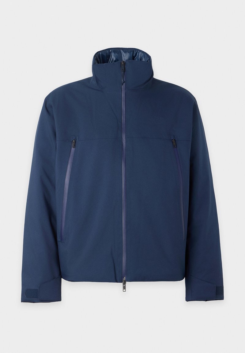 Marineblaue Jacke mit hohem Kragen, vorderem Reißverschluss und zwei Reißverschlusstaschen auf der Brust. Hergestellt aus einem glatten, strapazierfähigen Material mit lockerer Passform.