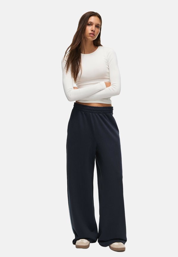 Bershka PLUSH - JOGGERS - Tracksuit bottoms - royal blue