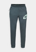 Dunkelgraue Jogginghosen aus weichem Stoff, mit einem elastischen Bund, seitlichen Taschen und einem großen weißen Nike-Logo mit Sprayeffekt.