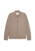 Beige Reißverschlussjacke mit vertikalen weißen Streifen, mit Kragen und Seitentaschen. Hergestellt aus strukturiertem Stoff mit glatter Oberfläche.