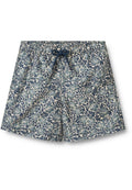 Blumenbadshorts mit einem blau-grünen Blatt- und Blumenmuster auf einem hellen Hintergrund, elastischem Bund und Kordelzug.