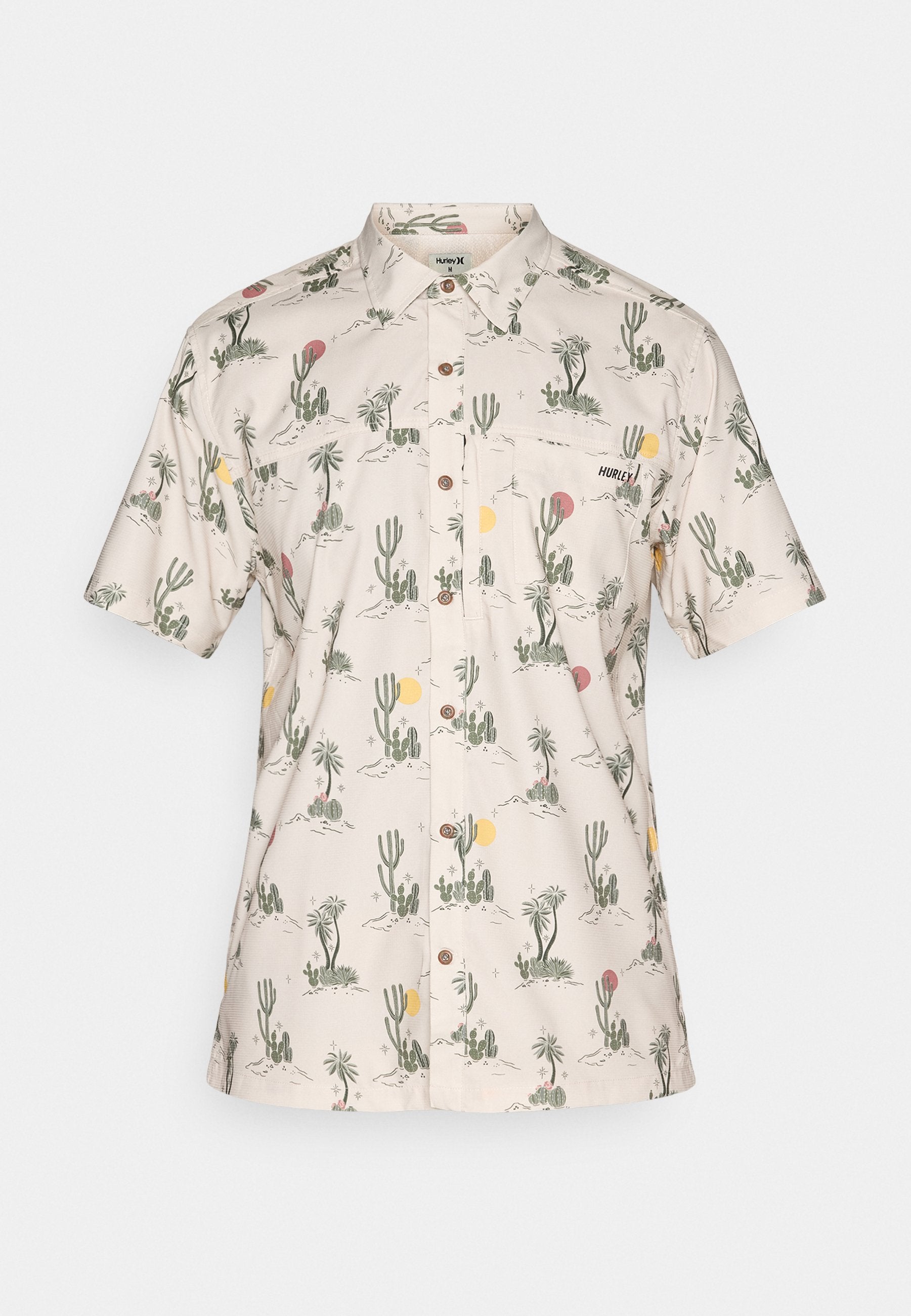 Kurzarmshirt aus beigem Stoff mit einem Muster aus Kakteen und Sonne. Verfügt über einen Kragen, Knöpfe und eine Brusttasche. Branding auf der Tasche.