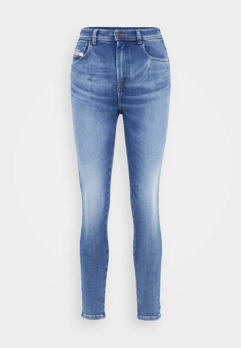Hautgeschnittene Skinny-Jeans aus hellblauem Denim, mit Knopfverschluss, zwei frontalen Taschen und ausgewaschenen Abschnitten für einen abgetragenen Look.