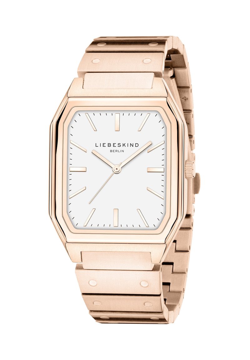 Rechteckige Uhr in Roségold mit weißem Zifferblatt, minimalistischen Stundenmarkierungen und einem polierten Metallarmband mit Nieten.