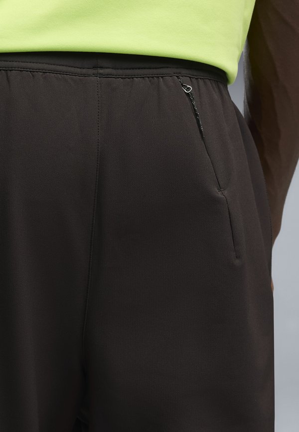 Puma WINDCELL LAUFHOSE - Tracksuit bottoms - black