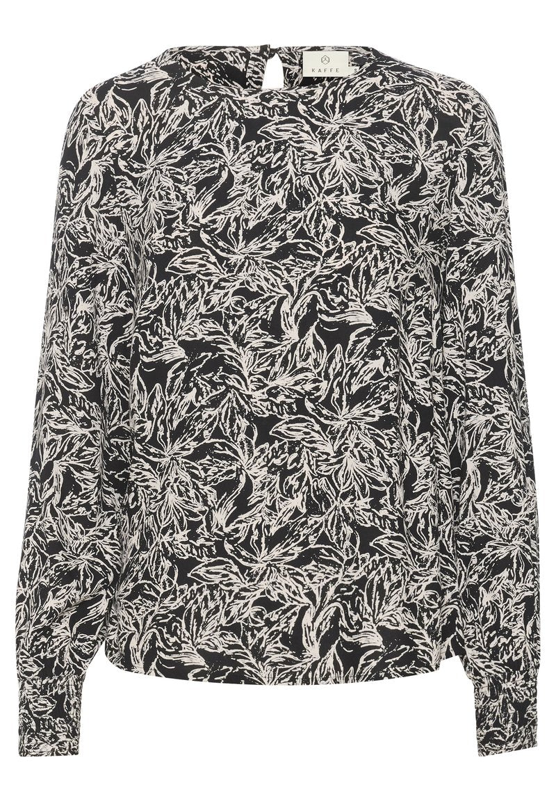 Langärmlige Bluse im schwarz-weißen Blumenmuster. Aus leichtem Stoff gefertigt, mit einem Schlitzdetail hinten und elastischen Bündchen.