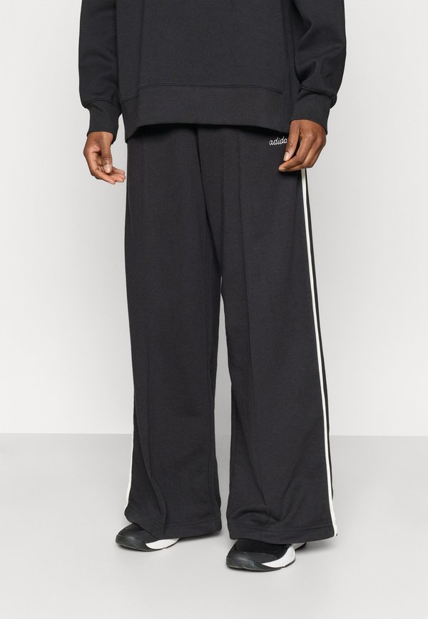 adidas Sportswear SEASONAL ESSENTIALS COLORPOP WITH EMBROIDERED GRAPHIC - Tracksuit bottoms - black/off white