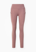 Mauve-farbene High-Waist Leggings mit Seitentaschen, eine davon mit Reißverschluss, und einem kleinen Nike-Logo im linken Hüftbereich.