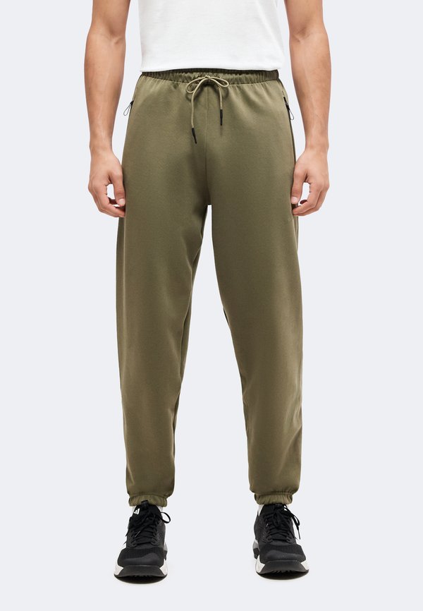 adidas Sportswear Z.N.E. PANTS - Tracksuit bottoms - olive strata