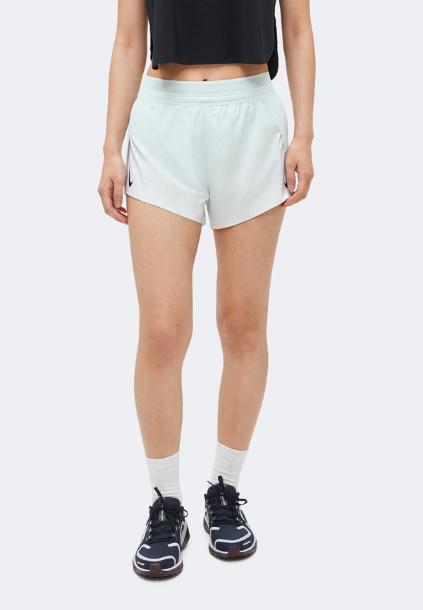 Nike Performance W NK ARSWFT DFADV MR 3IN SHORT - Sports shorts - barely green/black