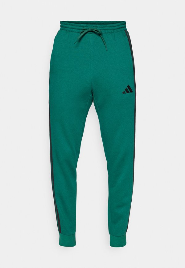 adidas Sportswear REGULAR FIT - Tracksuit bottoms - collegiate green/black