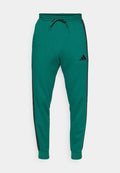 adidas Sportswear REGULAR FIT - Tracksuit bottoms - collegiate green/black