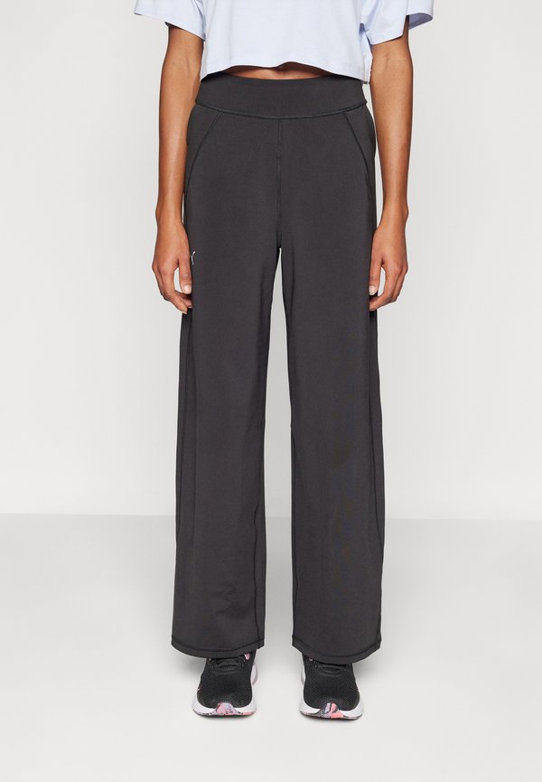 Puma MODEST PANTS - Tracksuit bottoms - black