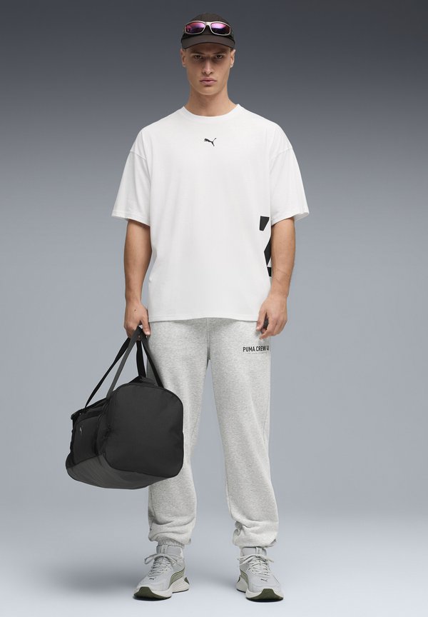 Puma GRAPHICS TRAINING JOGGING - Tracksuit bottoms - light gray heather