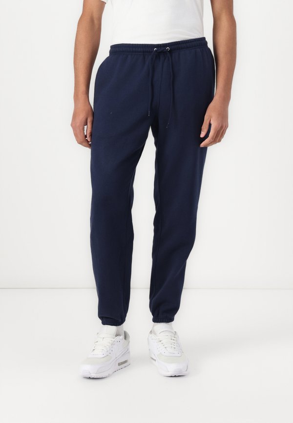 Nike Sportswear M NK CLUB BB CUFF PANT - Tracksuit bottoms - obsidian obsidian white