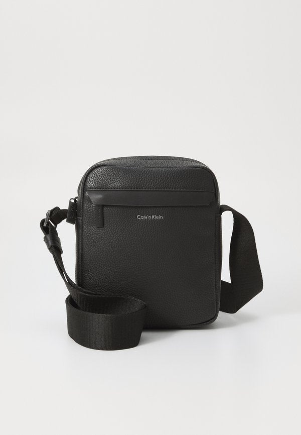 Calvin Klein MUST REPORTER - Cross body bag - black