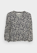 Blumenbluse mit einem marineblauen und cremefarbenen Muster, V-Ausschnitt und langen, leicht gepufften Ärmeln. Aus leichtem, strukturiertem Stoff gefertigt.