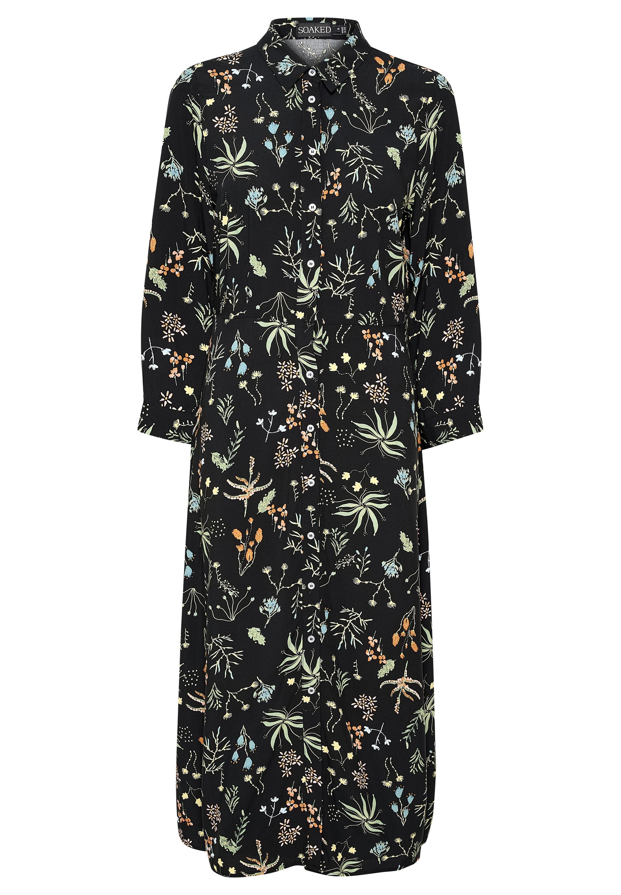 Schwarzes, blumiges Kleid mit einem Kragen, das vorne mit Knöpfen versehen ist. Der Stoff zeigt farbenfrohe Pflanzenmuster in Grün, Orange und Blau.