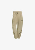adidas Sportswear ADIDAS Z.N.E. WOVEN - Tracksuit bottoms - beige