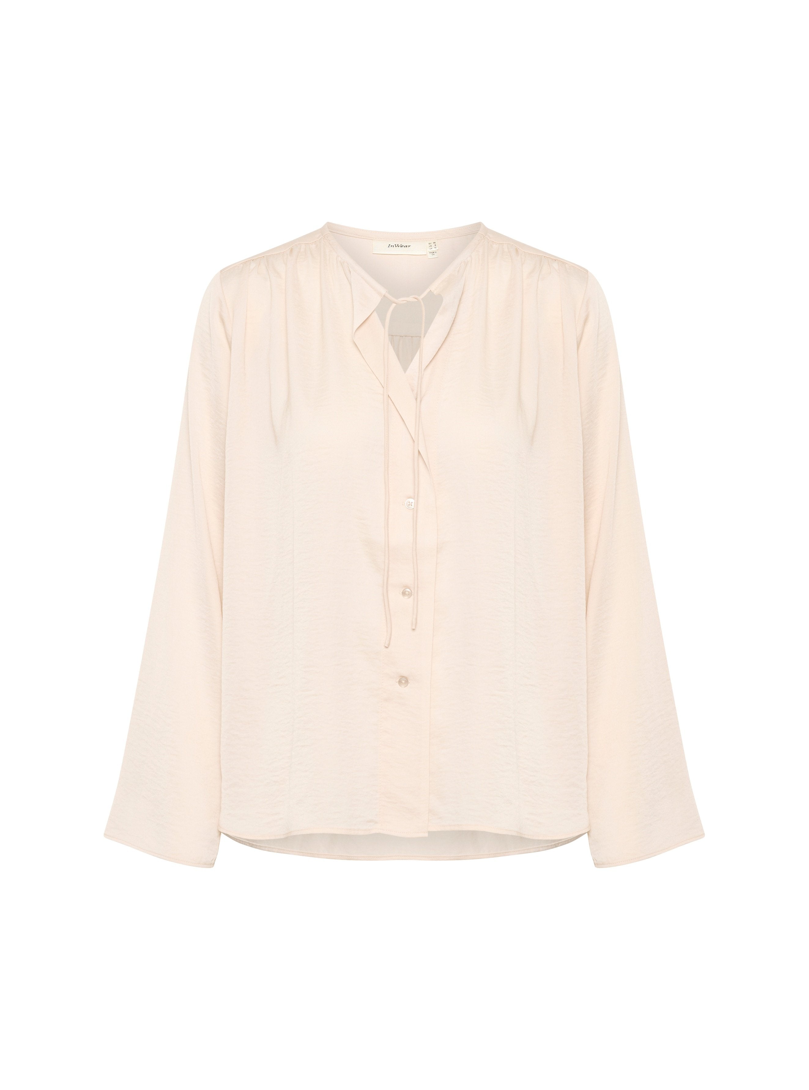 Helle rosa Bluse mit langen Ärmeln, Knopfleiste, Schlitzdekolleté und weichem, strukturiertem Stoff. Verfügt über sanfte Raffung an den Schultern.