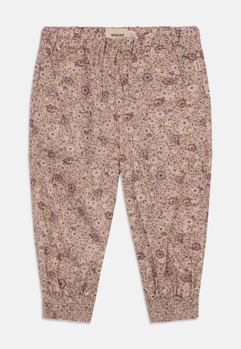Blumenmuster-Hosen in den Farben Pink und Beige, mit einem elastischen Bund und gerafften Knöchelbündchen für eine lockere Passform.