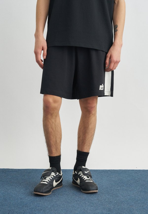 Nike Sportswear CLUB FUTBOL - Tracksuit bottoms - black/sail
