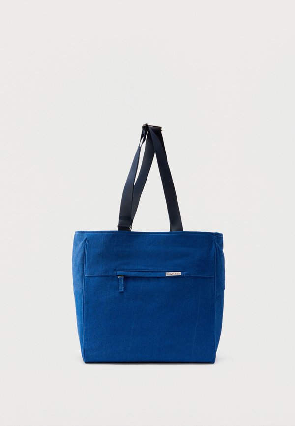 Calvin Klein SLEEK POCKET - Tote bag - true blue