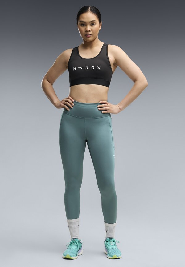 Puma PUMA X HYROX MID BRA - Medium support sports bra - puma black